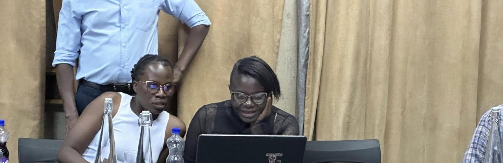 GLTN's Paul Gathogo (standing) takes People’s Process on Housing and Poverty in Zambia (PPHPZ) staff and federation members from the local community in Lusaka through the training on STDM.