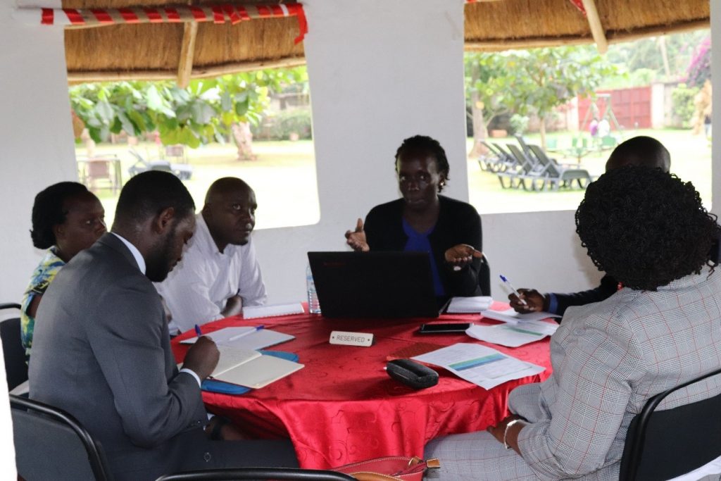 Ms. Jordana Wamboga of UCOBAC (centre) presenting on the integration of gender in land tenure security.